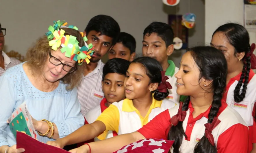 Students interacting with a visiting guest